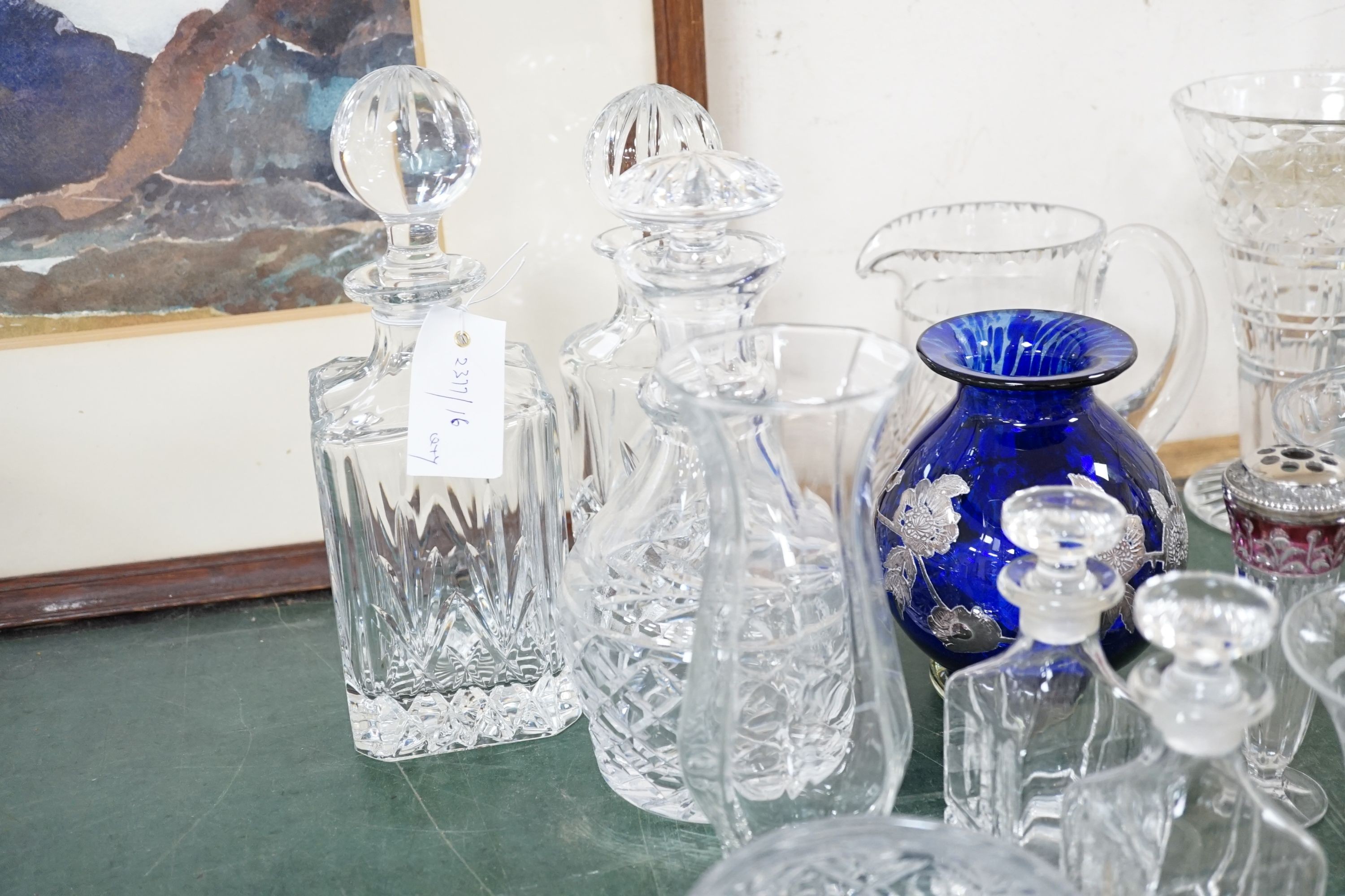 A quantity of cut crystal and other glassware to include decanters, vases, bowls etc